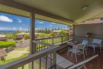The large lanai features a table with seating for four